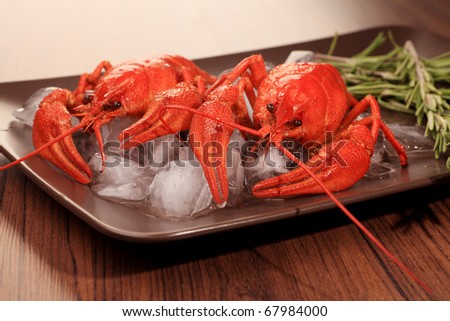 A dish with boiled crawfish with rosemary.