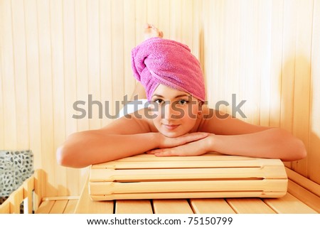 Beautiful young woman relaxing in the sauna. Beauty, healthcare.