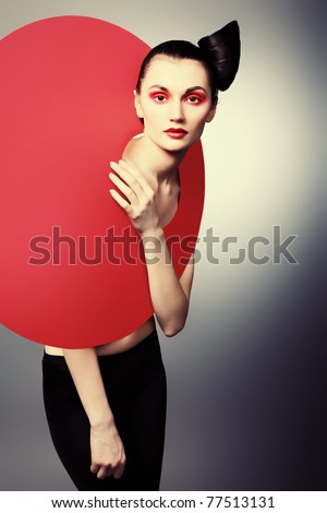 Fashion shot of an attractive model. Make-up. Shapes concept.