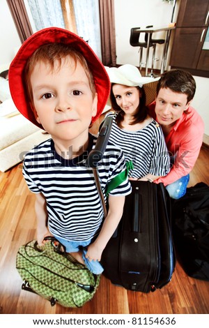The family at home with a big suitcases is going to vacation.