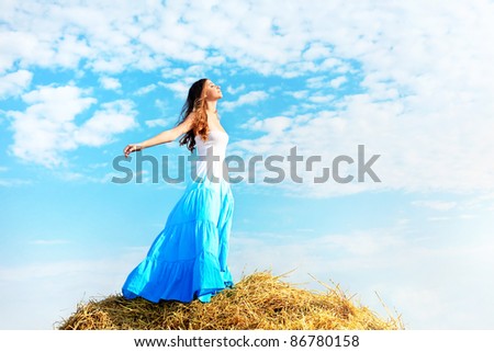Romantic young woman posing outdoor.