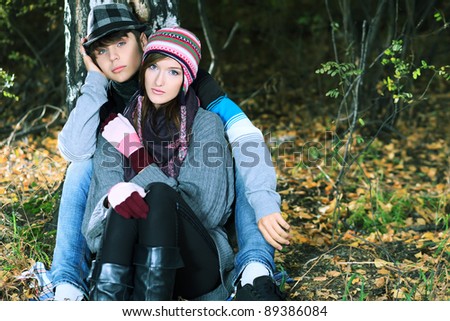 Portrait of a happy young couple in warm clothes outdoor.
