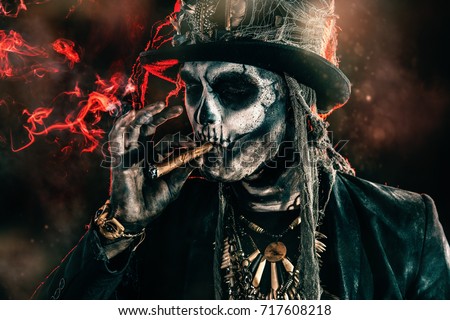 Baron Saturday. Baron Samedi. A man with a skull makeup dressed in a tail-coat and a top-hat. Dia de los muertos. Day of The Dead. Halloween.