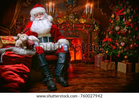 Surprised Santa Claus in a beautiful room next to the fireplace and Christmas tree sits with a sack of gifts .