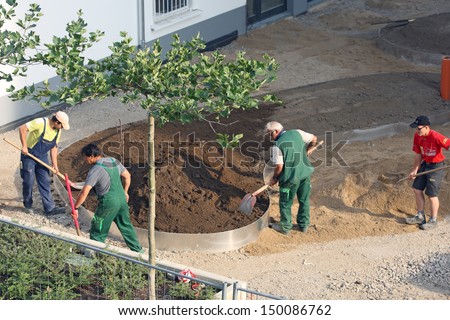 Dusseldorf - July 16: Workers Carry Out Landscaping On One Of The New Settlements In Dusseldorf, Germany On July 16, 2013