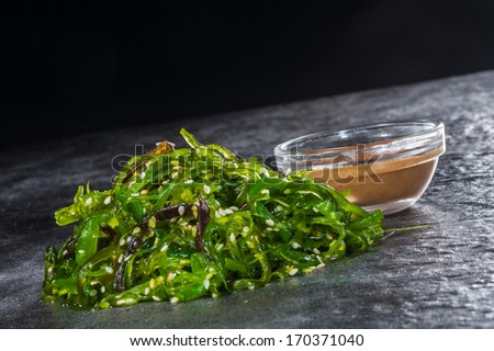 Japanese salad with seaweed, sesame and traditional sauce