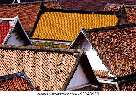 Orange and Yellow of the glazed roof tile ,The Monk house in Temple, Wat MahaTat Bangkok Thailand