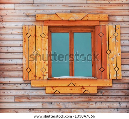 Window in an wooden peasant house, ethnic house and window,