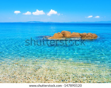 Untouched nature abstract archipelago in seashore with rocks in water in peninsula Halkidiki , Greece