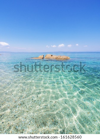 Paradise bay beach, untouched nature abstract archipelago in seashore with rocks in water on peninsula Halkidiki, Greece