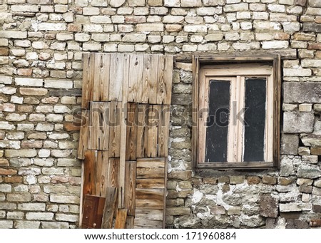 old wooden door and window of brick building