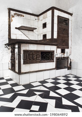 Serbian Old wood-burning stove in a kitchen , produced in 19th century
