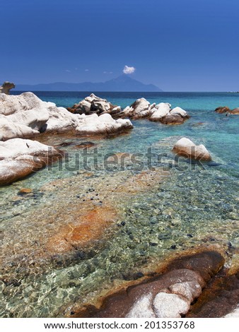 Paradise bay beach in Aegean sea, untouched nature abstract archipelago in seashore coastline with rocks in water on peninsula Halkidiki, Greece