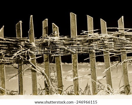 Frozen wooden fence night photo