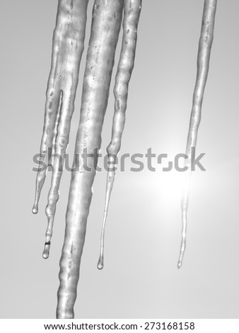 Abstract frozen thawing icicles with sun in background