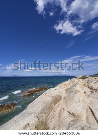 Greece beach, paradise bay untouched nature abstract archipelago in seashore with rocks in water on peninsula Halkidiki, Greece, \
relaxation landscape viewpoint for design postcard and calendar