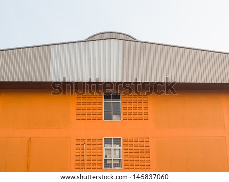 Orange small Office Building with Plant Arrangements