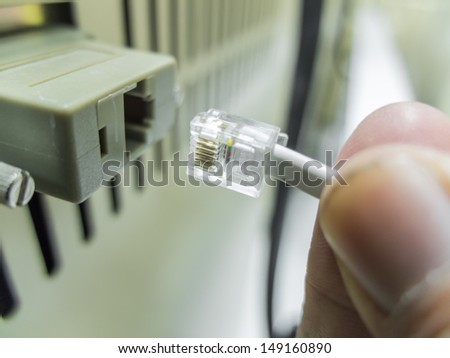 hand on connecting network cables to switches