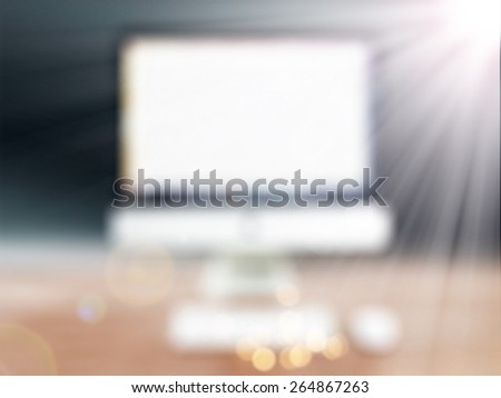 computer is on the table in a bright interior,abstract blur background for web design,colorful, blurred,texture,