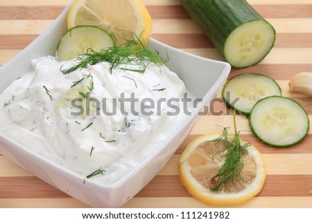 Tzatziki sauce made with yogurt, cucumbers, dill and lemon in a bowl