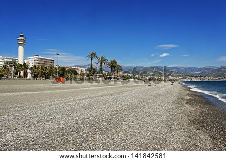 Lighthouse along the promenade at Torre del Mar\'s stony beach on the Costa Del Sol, Andalucia, Spain