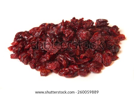 Pile of dried cranberries on a white background