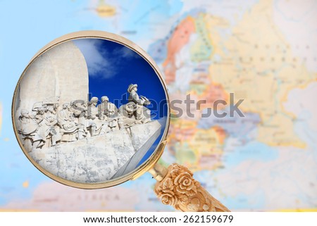 Looking in on the Explorers monument in  Portugal with a magnifying glass or loop with European map in the background