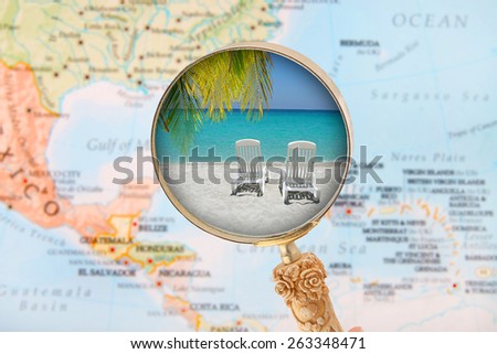 Looking in on a tropical beach with a blurred map of the Caribbean in the background