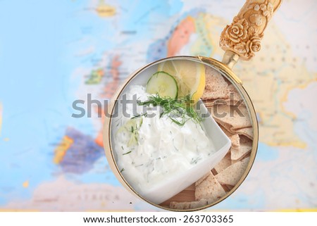World foods showing Europe with magnifying glass looking in tzatziki sauce or dip from Greece