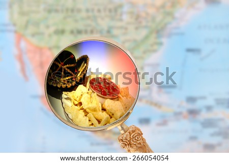 World food, looking in on Mexican nachos with blurred map of North America in the background