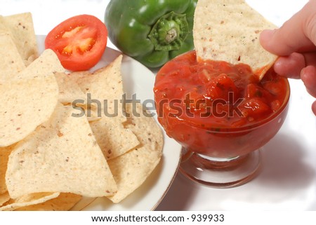dipping tortillas in salsa