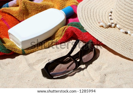 beach bag and beach items and sun block