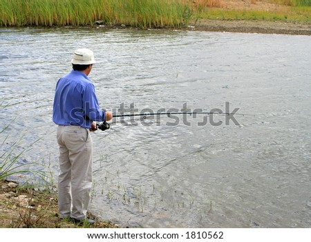 man with fishing pole in the hopes of a catch