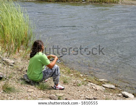 young teenage girl with fishing pole  in the hopes to catch a fish