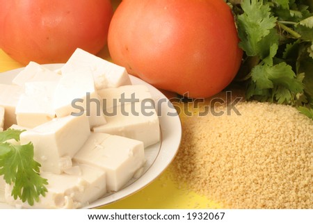 vegetarian food (tomato,tofu,parsley, and couscous)