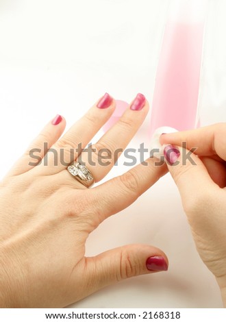 woman holds cotton ball with nail polish remover