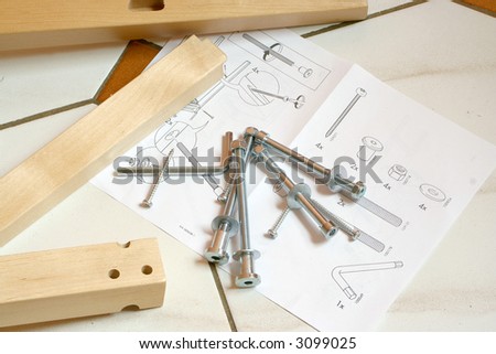 pieces of wood, screws and instructions for building furniture