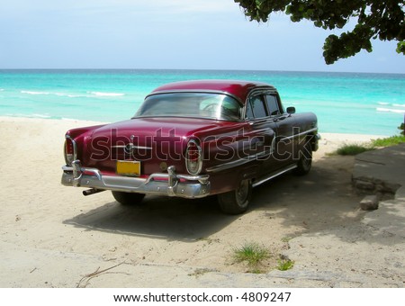 classic car from the sixties on the shores of Varadero beach, Cuba