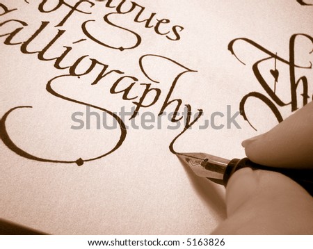 writing in calligraphy letter form on textured paper