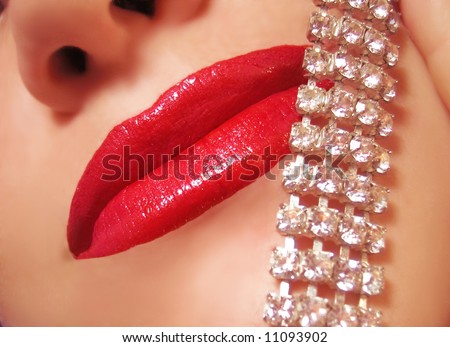 diamonds are a girl\'s best friend  woman\'s red lips with sparkling diamonds across the face