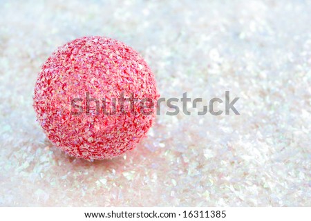 pink sparkly christmas decoration ball on white glitter great for backgrounds, name tags or greeting card