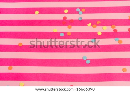 pink striped background with confetti great for parties