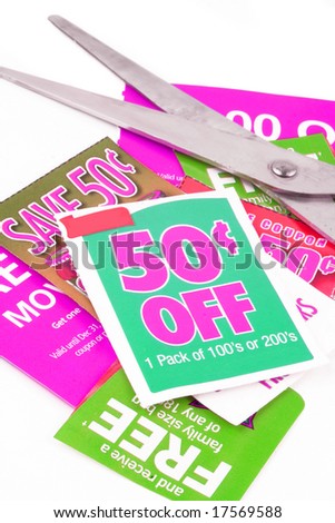 clipping coupons to save money at the grocery store