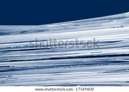 a stack of due  monthly bill payments in blue tones
