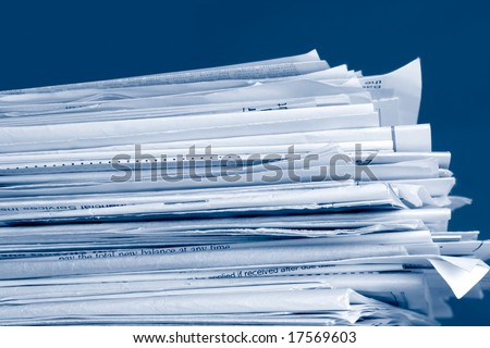 a stack of due  monthly bill payments in blue tones