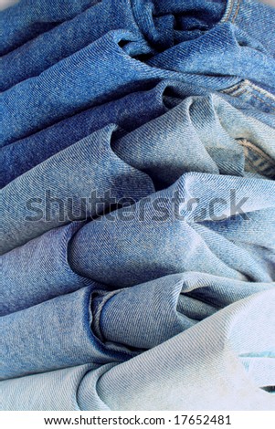 pile of different shades of blue jeans