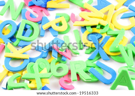 pile of letters and numbers abc and 123s on a white background
