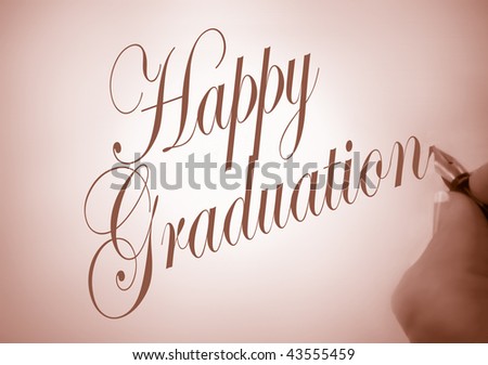 Person writing Happy Graduation in calligraphy in sepia tone