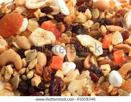 Closeup of delicious and healthy mixed dried fruit, nuts and seeds great for a background
