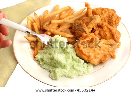 Southern fried chicken, french fries smothered with gravy and creamy coleslaw dinner on a white background